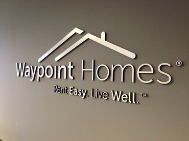 1/2" thick black sign foam with brushed aluminum face. Installed in reception of office