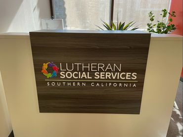 1/4" thick PVC lobby sign on modesty panel reception area.