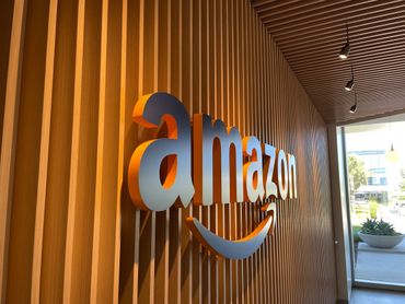 Non-illuminated channel letters installed in reception area. Installation stud mount onto wood slats