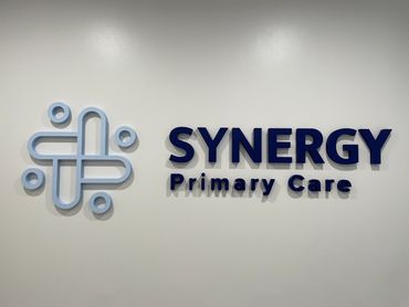 1/2" thick acrylic lobby sign with painted faces and edges, installed directly to lobby wall.