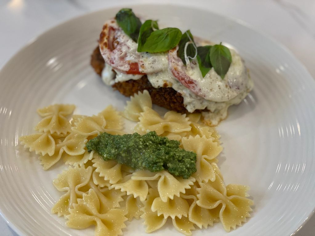 Chicken Caprese with Farfalla Pasta on the side with homemade pesto. Chicken Breast Fried, then topp