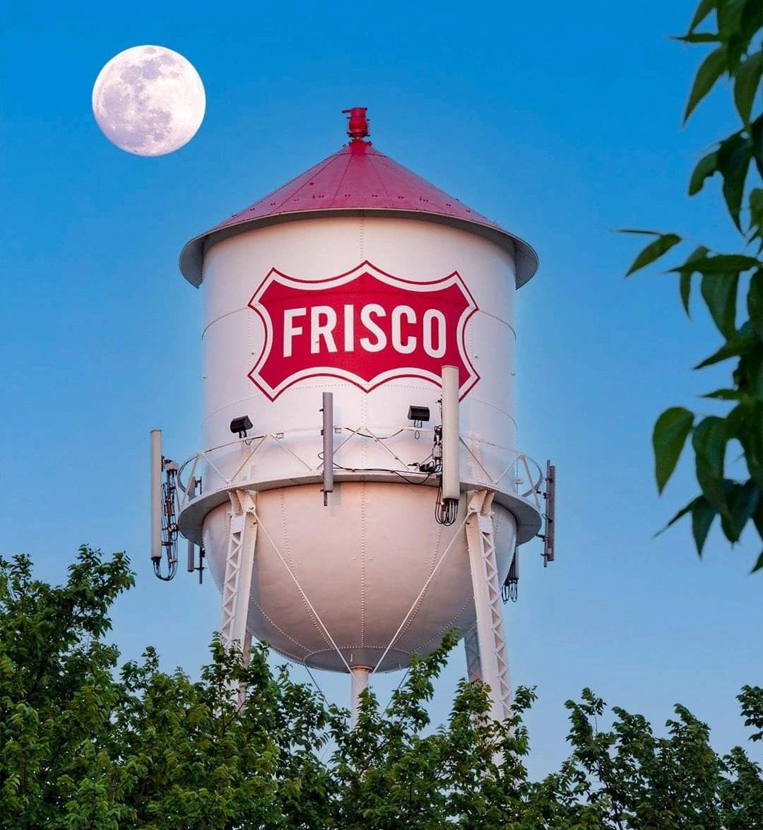 Frisco water tower beautiful photo with moon in background.
