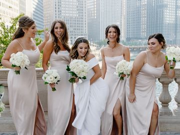 Bridesmaid in white color gown and bouquets