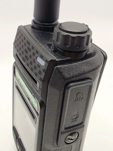 Close-up of a black handheld walkie-talkie device.