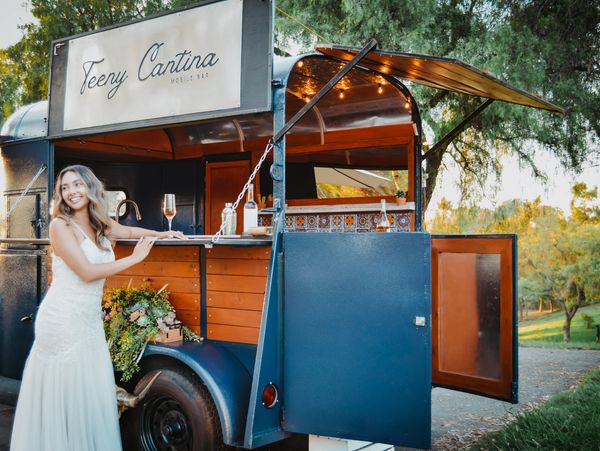 bride ordering from mobile bar 