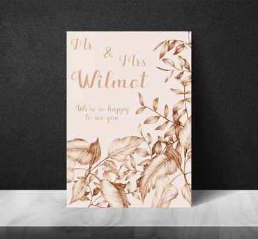 Welcome sign with linear foliage