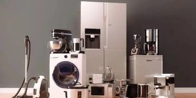A collection of modern household appliances arranged together.