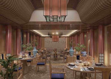 Elegant restaurant interior with wooden furniture and blue cushions.
