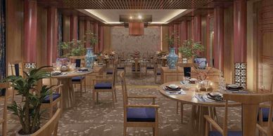 Elegant restaurant interior with wooden furniture and blue cushions.