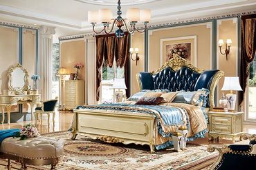 Luxurious classic bedroom with ornate furniture and rich fabrics.