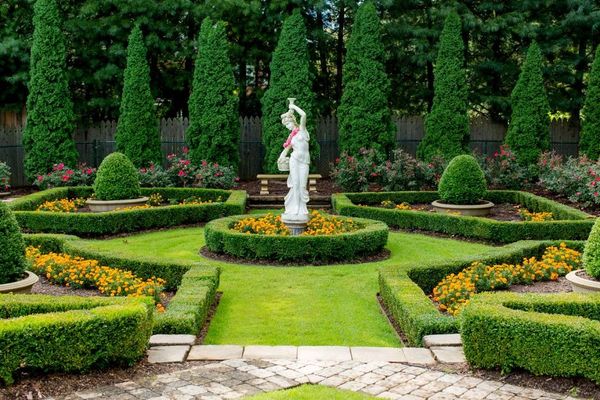 Entry to a Formal Garden with borders containing internal patterns to create  symmetrical  balance.