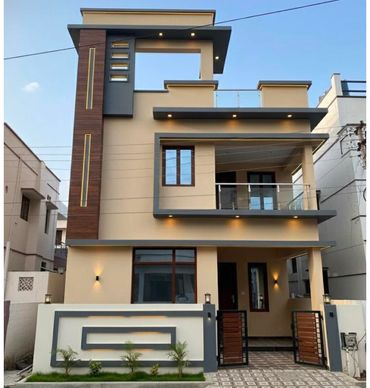 Modern two-story house with beige and gray exterior.