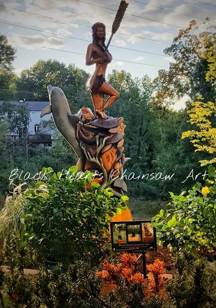 Hawaiian Themed onsite Sculpture in Des Peres Mo Hawaiian Fire Goddess Pele dolphins sea turtles