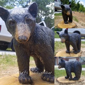 Bear cub Chainsaw carving black hearts chainsaw art midwest artist sculpture st. louis art gallery