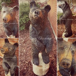 Bear cub Chainsaw carving black hearts chainsaw art midwest artist sculpture st. louis art gallery