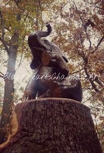 Wooden Hand Carved Sitting Elephant Sculpture - Chainsaw Carving