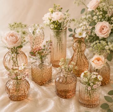 Delicate flowers in vintage glass vases.