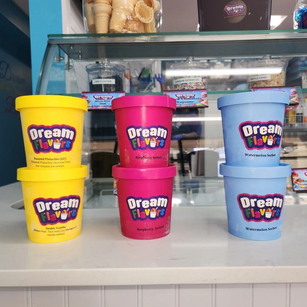 Colorful Dream Flavors ice cream and sorbet tubs on display.