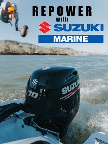 Suzuki Marine outboard motor powering a boat on the water.