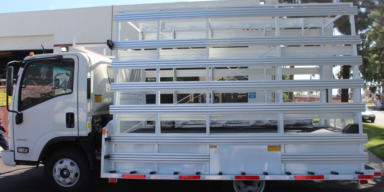 chassis-mounted weldco glass rack on an isuzu lcf cab chassis