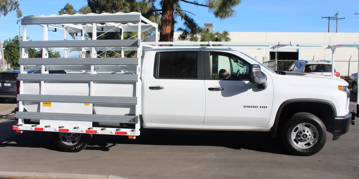 bed-mounted weldco glass rack on a chevy truck
