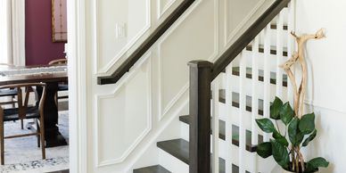 stair case with custom wall panelling