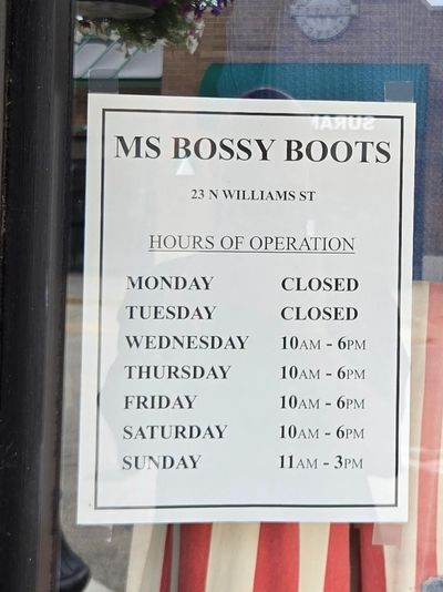 Name of business and schedule of open times
On the entrance door of Ms Bossy Boots in Crystal Lake