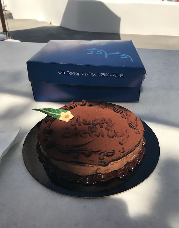 Celebrating my birthday. The hotel sent champagne and cake to our luxury cave villa, Oia, Santorini