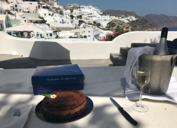 Celebrating my birthday. The hotel sent champagne and cake to our luxury cave villa, Oia, Santorini