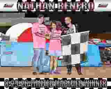 Three people celebrating a race win with a checkered flag.