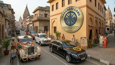 Vintage and modern decorated cars on a street in Varanasi for wedding services.