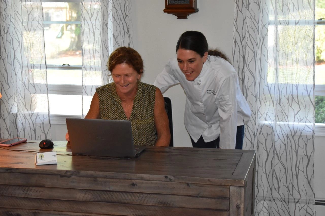 Judy and Chef Meghan reviewing events for the upcoming week