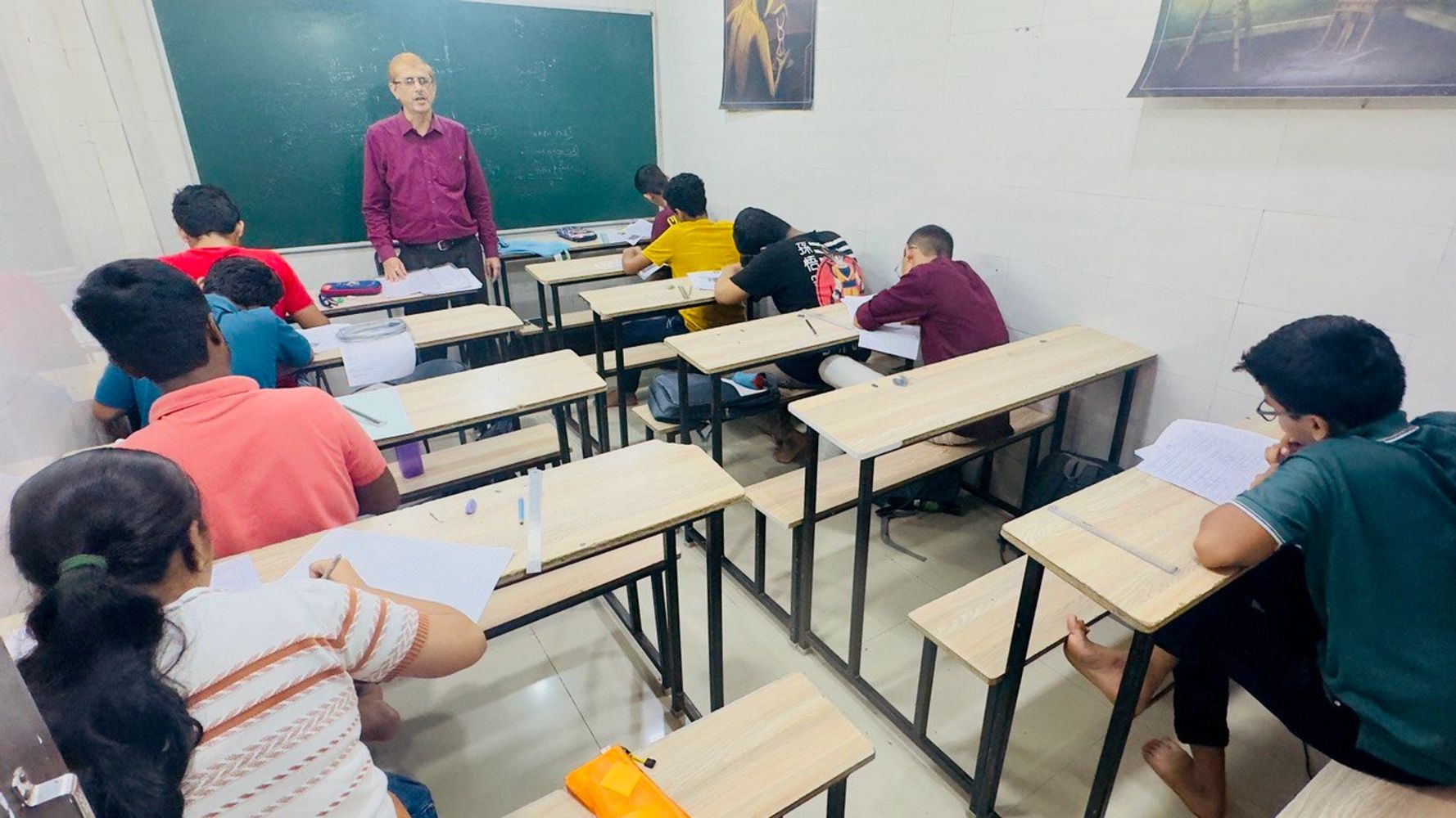 Students giving tests in the classroom