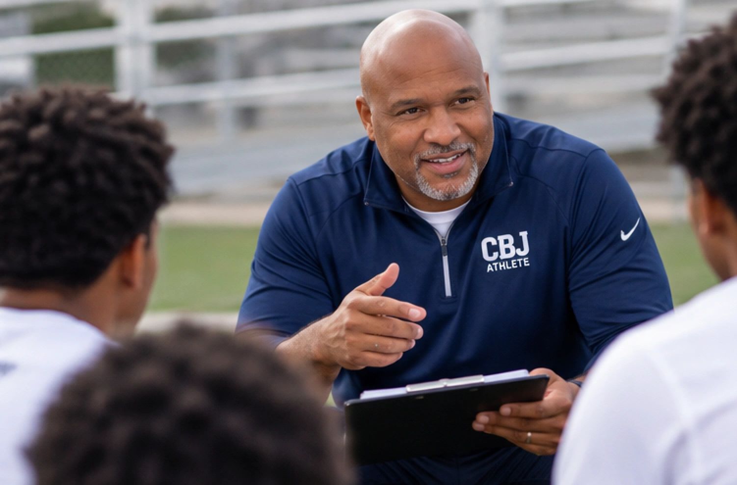 Coach giving instructions to players.