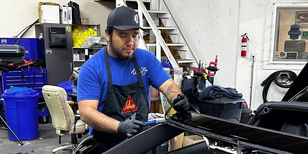 Technician cutting old urethane before applying a new layer