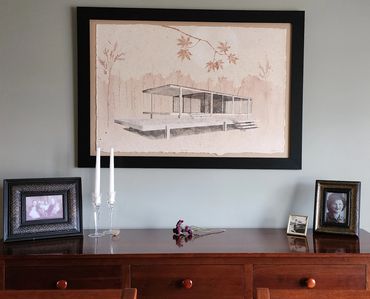 House of Glass pulp painting with traditional framing, artwork floated on top of mat.
