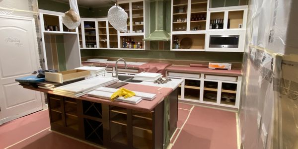 Kitchen undergoing a refresh by getting the cabinets and doors painted.