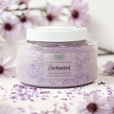 Oval clear 8 ounce plastic jar with light purple whipped body polish inside of jar.