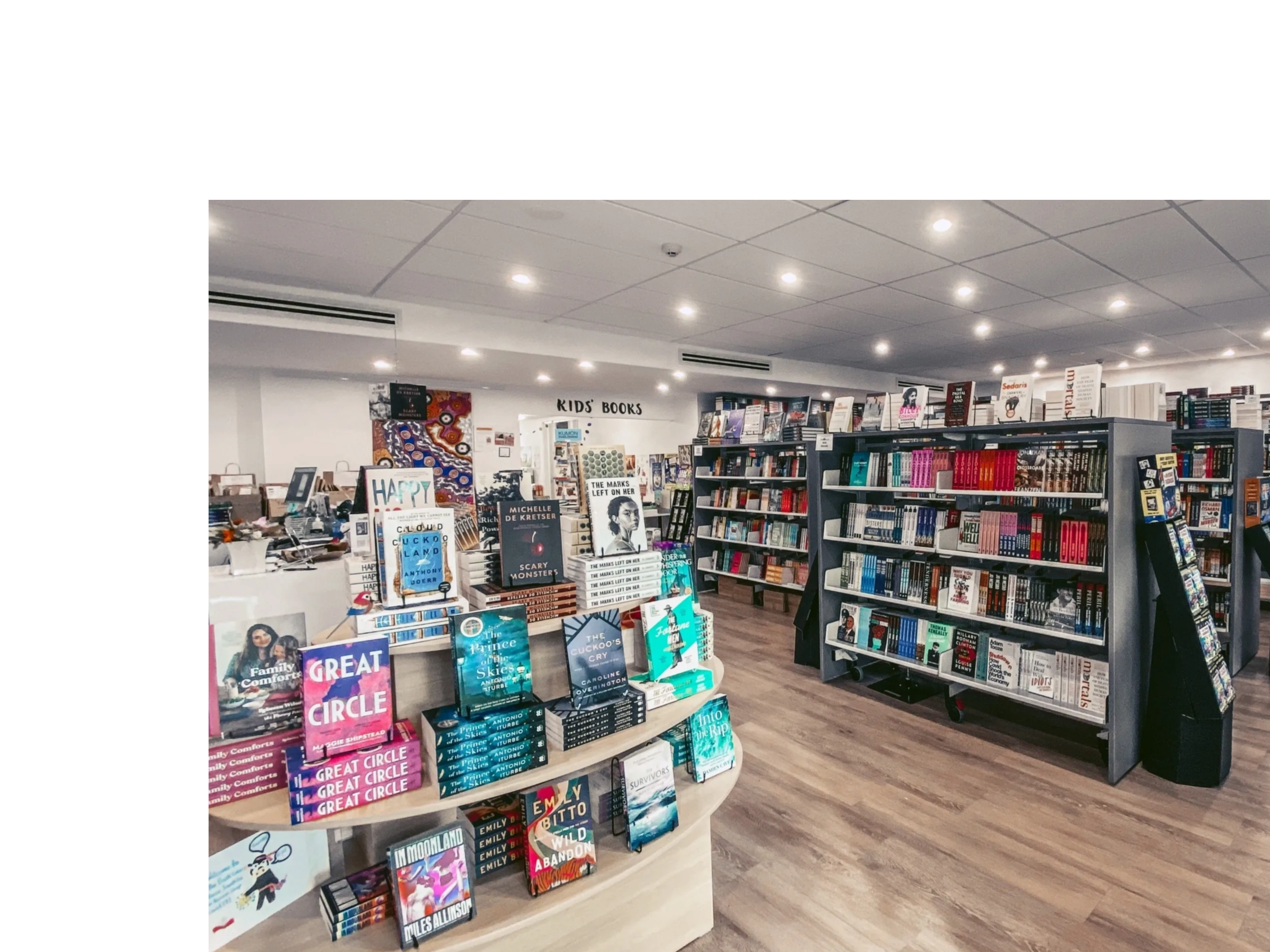 Inside the Book Cow bookshop, showing shelves and books.