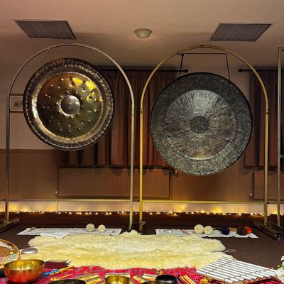 Two gongs set up with crystal and Tibetan bowls for an all night gong bath