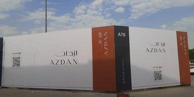 Large outdoor sign for Azdan with QR codes.