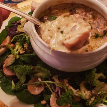 Coquille St. Jacques Scallops in Bowl with Spoon and Salad