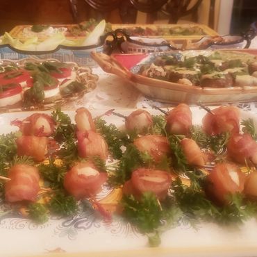 Super snacks on platters: bacon-wrapped water chestnuts and scallops, tomato mozzarella tea sandwich