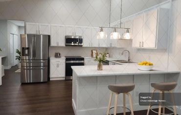 Gourmet kitchen that is equipped with top-of-the-line stainless steel appliances,Quartz countertops,