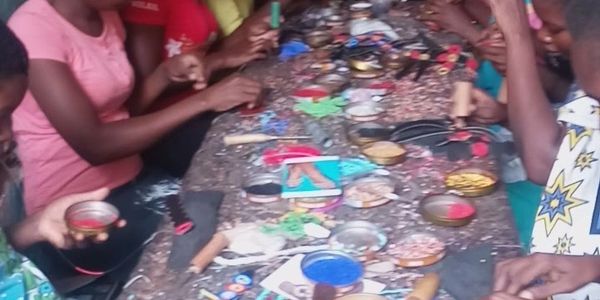 Manufacturing of slippers by Africans on hand