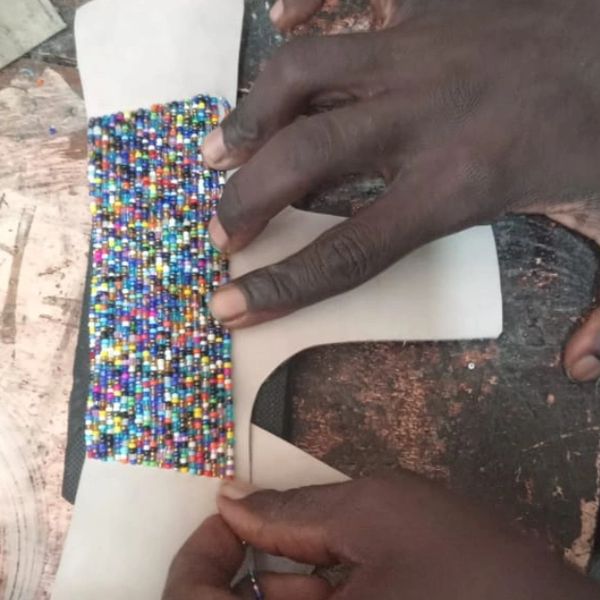 Manufacturing of slippers by Africans on hand