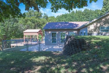 Fenced area behind house