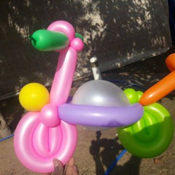 Colorful balloon sculpture shaped like a bird or animal.