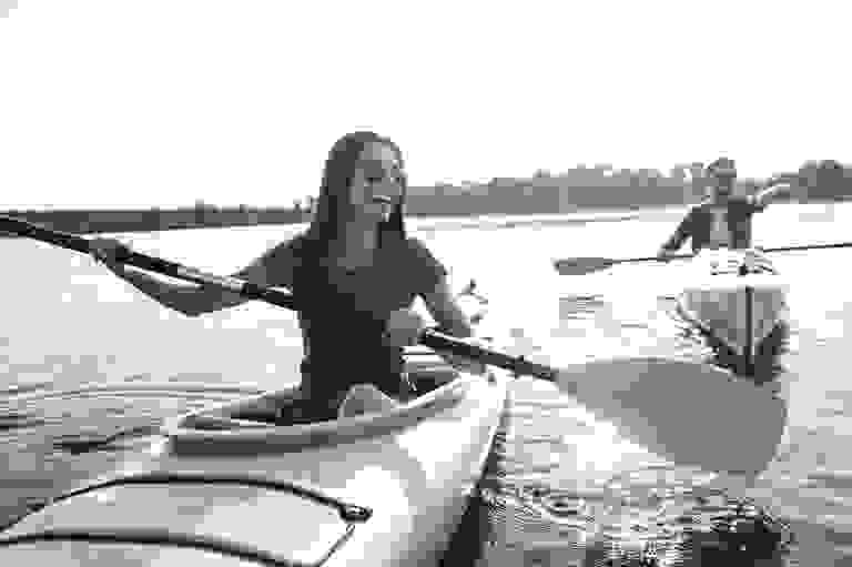 Man and woman paddling their kayaks in the Low-Country.