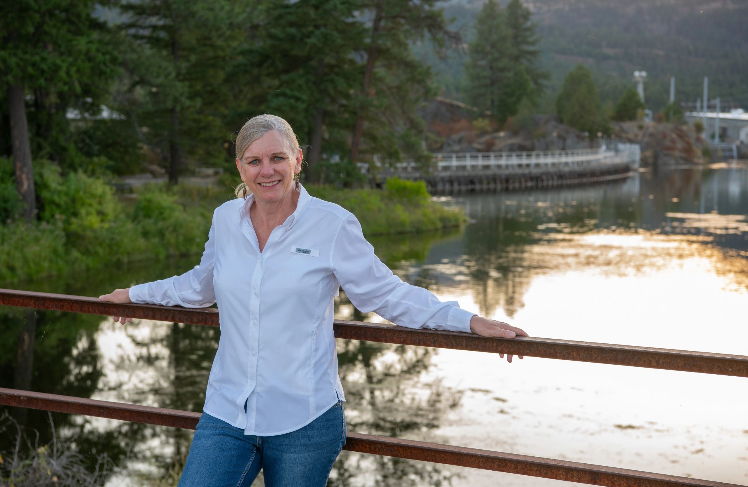 Jennifer Fielder with the Thompson Falls Hydro Electric Project in the background.